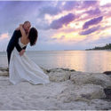 recently married couple kissing on a Key West beach at sunset